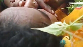 Desi's rustic lover fucks behind the door.