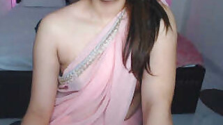 Hot cousin in transparent sari shows off her milky white tits and says dirty things