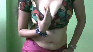 Lusty Bhabhi is having a great time showing off her erotic dancing and her big tits