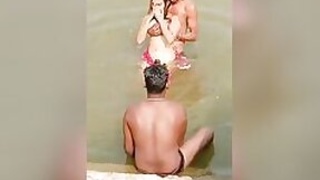 XXX video of girl Desi flirting with a bunch of guys in the river