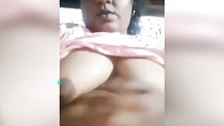 Mature auntie shows her xxx breasts and plays with her Desi cunt