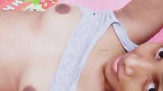 A horny teenager showing her breasts and pussy