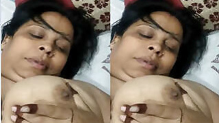 Bhabhi is playing on camera with her big tits